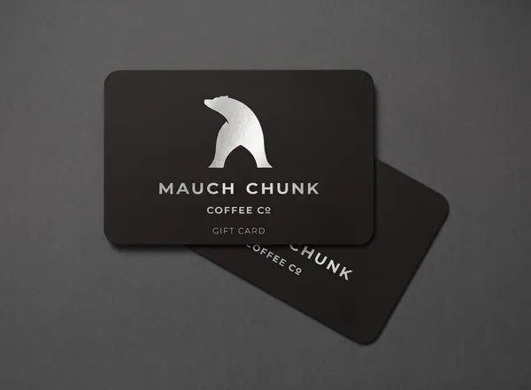 Black gift card with white bear logo and text on a dark gray background