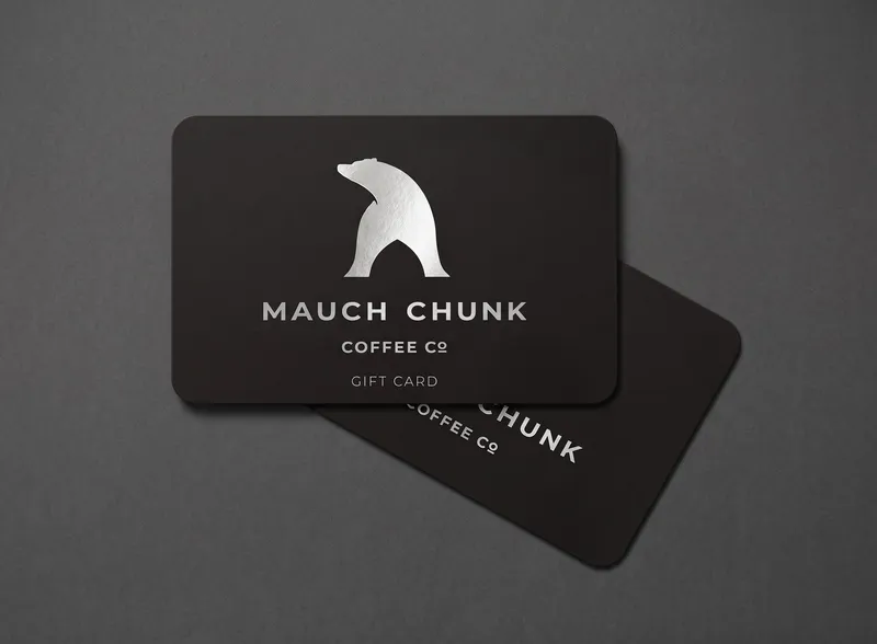 Black gift card with white bear logo and text on a dark gray background